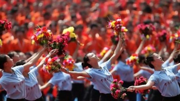 Students perform at the opening ceremony of a revolutionary song concert in Chongqing municipality.