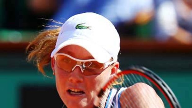 Samantha Stosur of Australia plays a backhand during the semi-final against Jelena Jankovic.