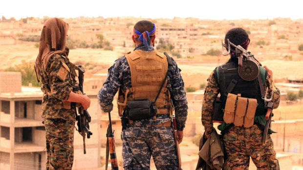 Fighters from the Syrian Democratic Forces looking toward the northern town of Tabqa, Syria. US-backed Syrian forces have launched their attack on the Islamic State group's de facto capital of Raqqa, in northern Syria.