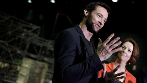 Special deal ... The Wolverine star Hugh Jackman with Prime Minister Julia Gillard on the movie set at Fox Studios last year.