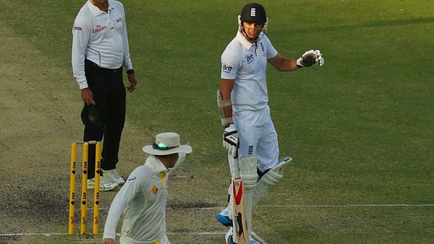 Michael Clarke and James Anderson exchange words.