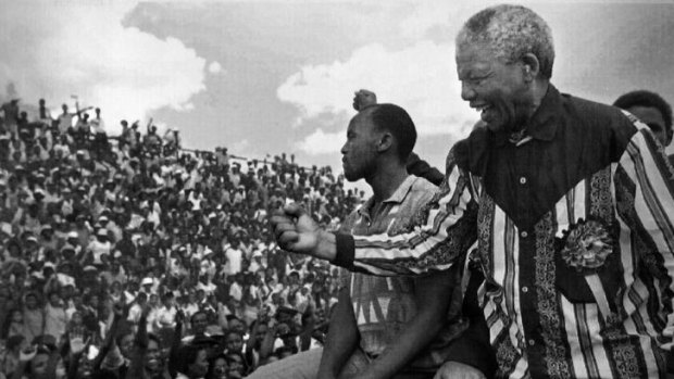 Man of the people: Nelson Mandela greets crowds in 1994.