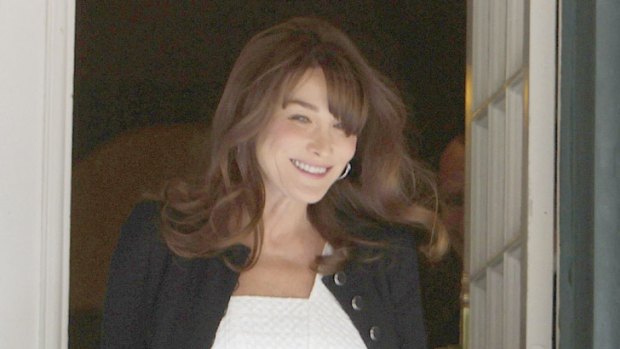 Belly glance ... Carla Bruni's appearance at the G8 meeting confirms pregnancy rumours.
