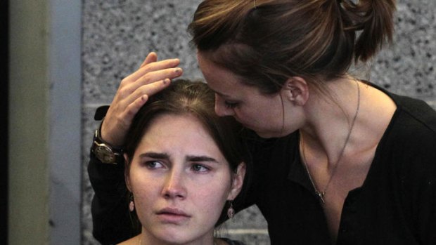 Free at last: Relieved after her ordeal, Amanda Knox is comforted by her sister Deanna Knox during a news conference in Seattle after her return home.