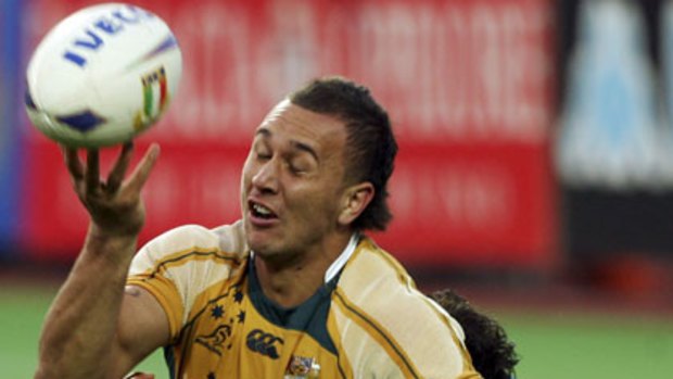 Quade Cooper juggles the ball during the clash against Italy in Canberra