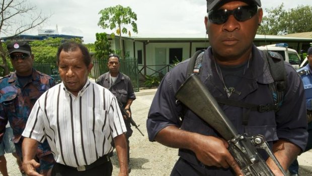 Failed coup leader, retired colonel Yaura Sasa under arrest at the Waigani District court in Port Moresby.