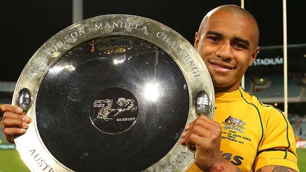 To the victor goes the spoils ... Will Genia poses with the Nelson Mandela Challenge Plate.