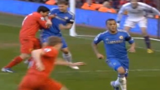 Liverpool's Luiz Suarez biting Chelsea defender Branislav Ivanovic.