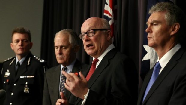 AFP Commissioner Andrew Colvin, Communications Minister Malcolm Turnbull, Attorney-General George Brandis and Director-General of Security Duncan Lewis address the media.