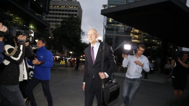 Peter Garrett leaves the home insulation inquiry after giving evidence.