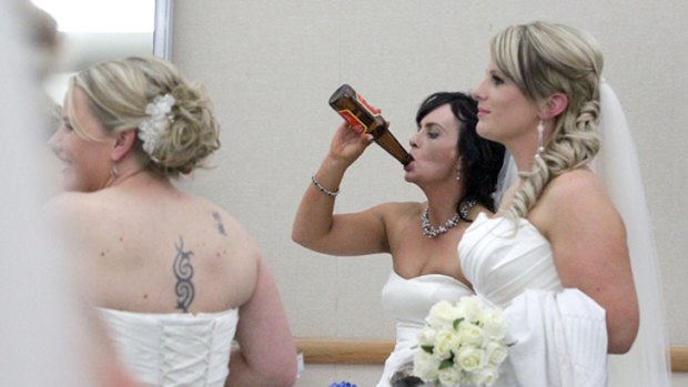 What's wrong with this picture? ... Katrina Hayman was snapped swilling a beer at the Taranaki Bride of the Year contest.