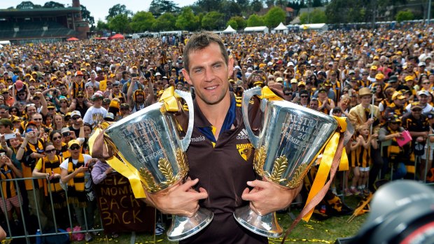 Hawthorn Captain Luke Hodge with the 2014 and 2013 premiership cups. 