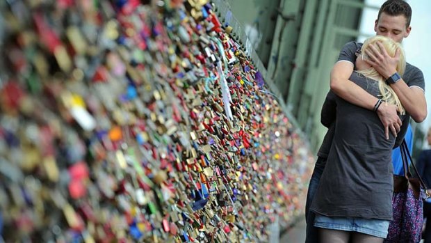 Too much affection: The weight of thousands of 'love locks' causes a 2.4-metre railing to collapse in the French capital.