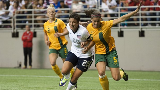 Jostling for possession: American player Abby Wambach and the Maltidas' Laura Alleway battle for the ball in 2013. 