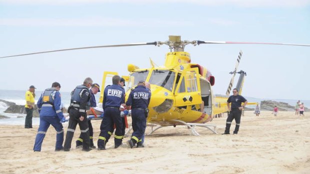 A helicopter is used to transport the man to hospital from Diamond Head, in the Crowdy Bay National Park near Port Macquarie, NSW.