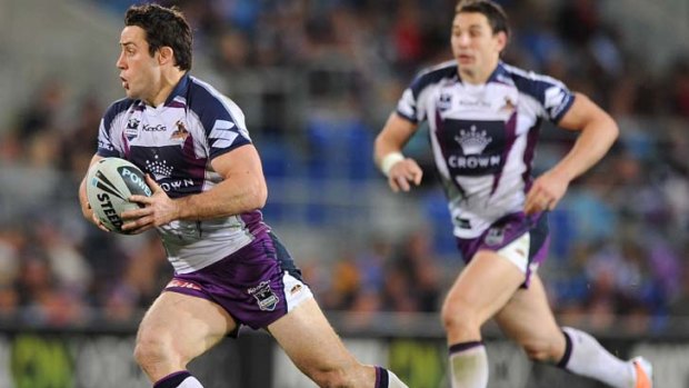 Storming the record books &#8230; Cooper Cronk runs the ball in round 23 before succumbing to injury.