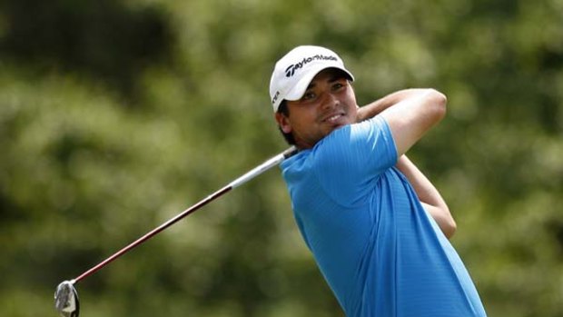 Jason Day of Australia hits from the twelfth tee.