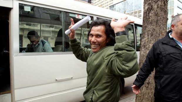 Sawal Eik leaves the County Court yesterday after 16 Indonesians were granted bail or had their bail extended.