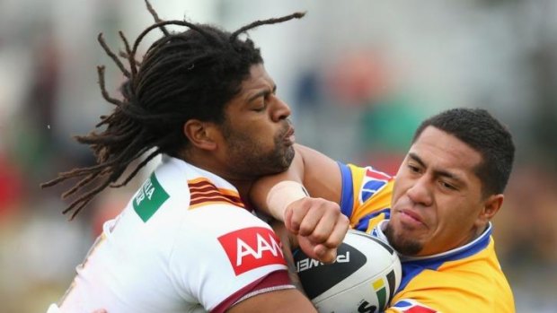 On the way up: Jamal Idris of Country tackles Jorge Taufua of City on Sunday in Dubbo.