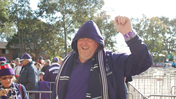 That's the purple passion - Dockers fan Scott Winter has been lining up to get tickets since 8:30pm on Sunday night.