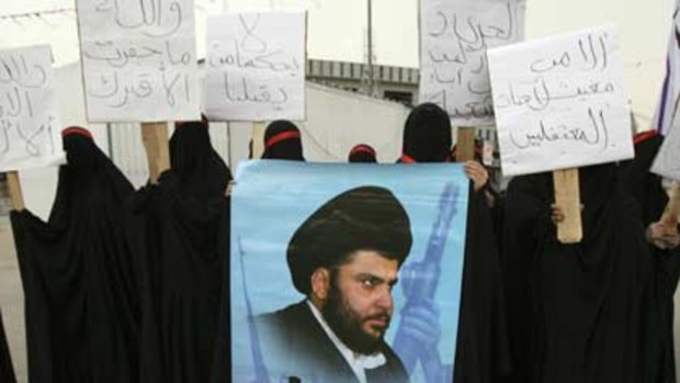 Anti-government protests ... Iraqi Shiite women with banners of the radical cleric Muqtada al-Sadr.