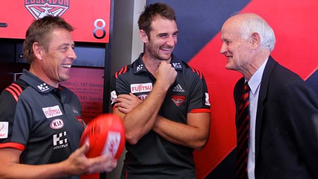 Essendon coach Mark Thompson, captain Jobe Watson and former premiership captain Ken Fraser at the Bombers' 2014 membership launch on Wednesday.