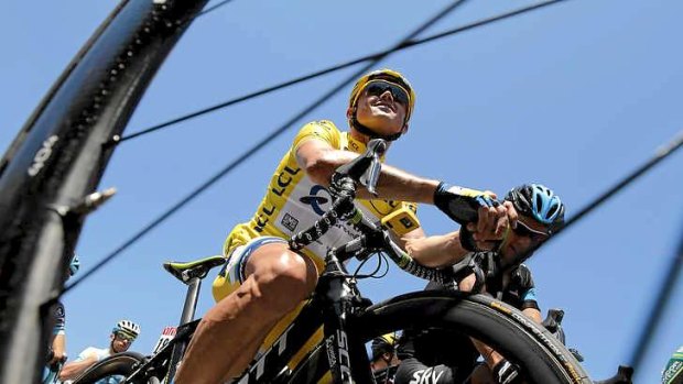 Simon Gerrans of Australia, wearing the overall leader's yellow jersey, waits for the start of the sixth stage of the Tour de France.