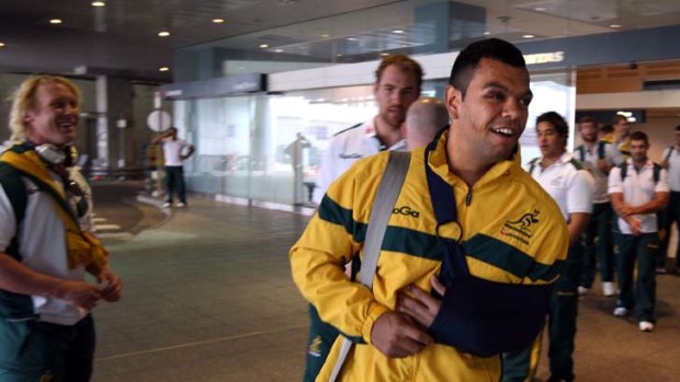 On a high ... Kurtley Beale at Sydney airport yesterday as the Wallabies prepare to fly to Brisbane for a training camp following their 39-20 win over South Africa..
