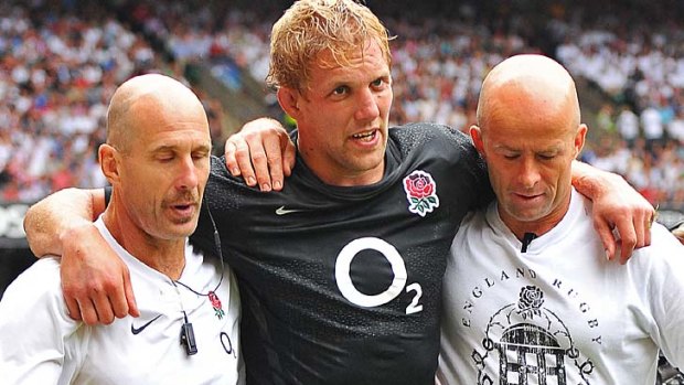 Lewis Moody is helped off the pitch against Wales.