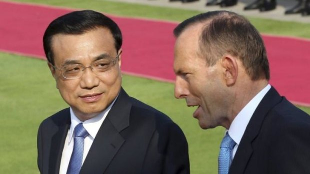 China's Premier Li Keqiang talks to Tony Abbott during the Prime Minister's visit to China.