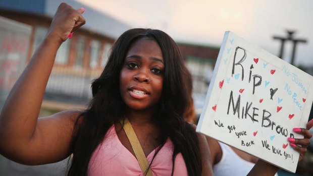 Arniesha Randall protests the killing of 18-year-old Michael Brown who was shot by police on Saturday on in Ferguson, Missouri.