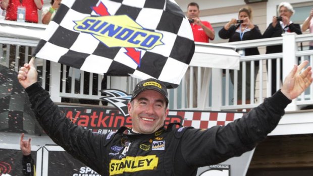 Marcos Ambrose celebrates his maiden NASCAR Sprint Cup Series victory at Watkins Glen.
