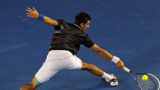 On his way ... Novak Djokovic reaches for a return against Rafael Nadal as he works his way to a win.