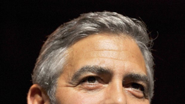 Sore point ... George Clooney mocks reporter for love life question.