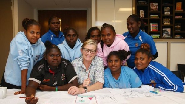 Fast workers: Students from the Tiwi Islands put down their ideas with author and illustrator Allison Lester.