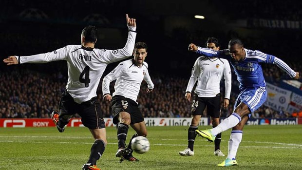 Chelsea's Didier Drogba scores one of his two goals against Valencia.