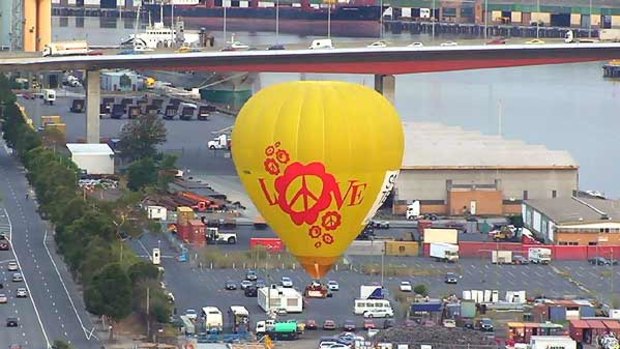 One of the balloons descends in Docklands this morning.