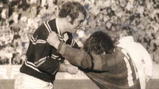 Toughest Rabbitoh of all: George Piggins, right, mixes it up with Manly's Malcolm Reilly.
