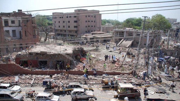 The destroyed police emergency response office building following a suicide car bomb attack in Lahore.