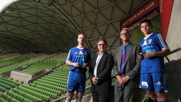 Michael Eagar, senior captain for South Melbourne, Michael Ephraim, managing director, Sony Computers Entertainment Australia, David Gallop, and under-12 player Adam Brigo pose for the cameras during the NPL finals series and partnership launch at AAMI Park on Monday.