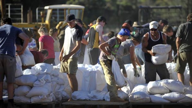 Residents fill sandbags at Pental Island near Swan Hill.