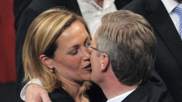 Germany's new President Christian Wulff, right, kisses his wife Bettina Wulff.