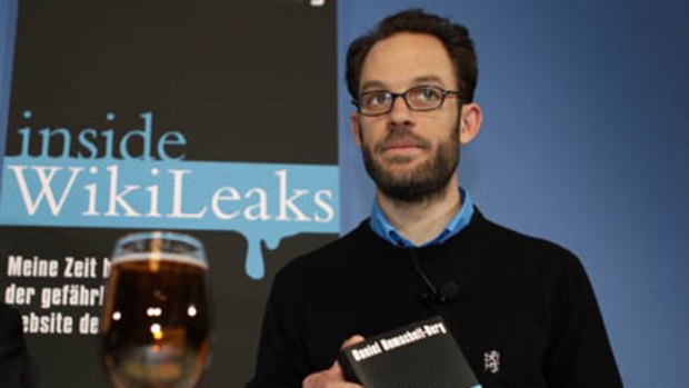 One of the founders of OpenLeaks, Daniel Domscheit-Berg, holds his book <i>Inside WikiLeaks</i>.