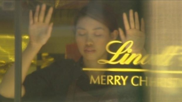 Seven had the footage advantage ... Elly Chen being held hostage inside the Lindt cafe.