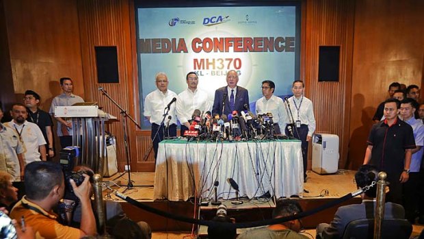 Malaysian Prime Minister Najib Razak (centre) addresses the media.