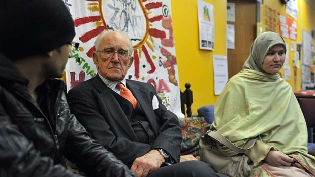 Malcolm Fraser at the Asylum Seekers Resource Centre with refugees Arshad Isbal and his wife Wajihi Arshad.