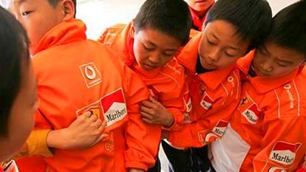 A message from their sponsor &#8230; students in KunMing Province, whose uniforms are covered in Marlboro advertisements.