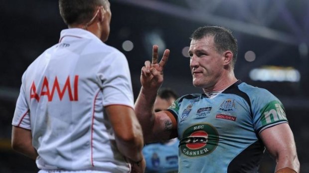 Paul Gallen of the Blues speaks with referee Shayne Hayne during game one.
