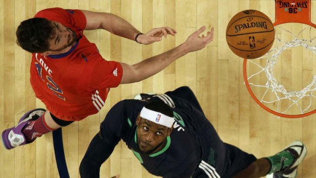 Kevin Loveand LeBron James compete for a rebound during the NBA All Star game in New Orleans.