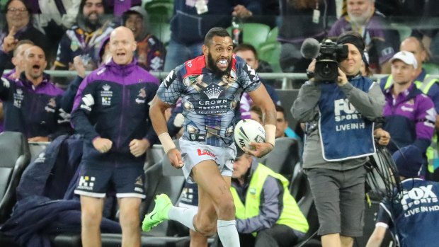Game breaker: Josh Addo-Carr of the Melbourne Storm runs away to score the match-sealing try.